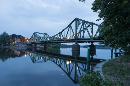 Glienicker Bridge is reflected in the Havel in Potsdam