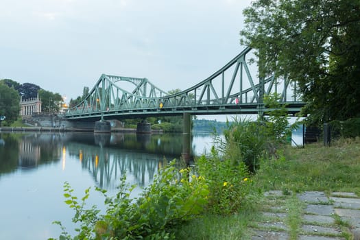 Glienicker Bridge in Potsdam in front of dark clouds