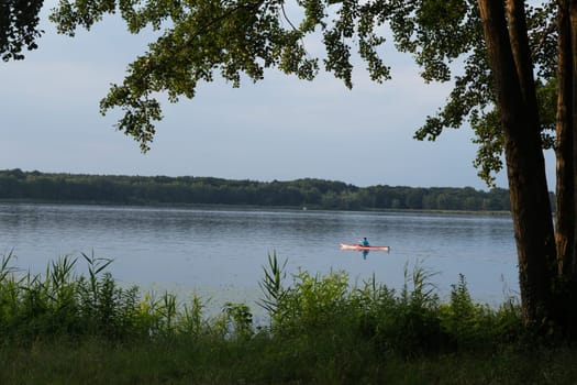 Paddler in a red boat on the Jungfernsee