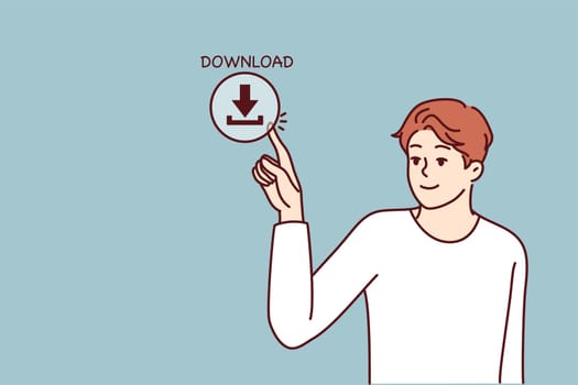 Young man presses download button on screen for concept of web content consumption and network use. Guy downloads information from Internet using cloud storage or torrent clients with media files