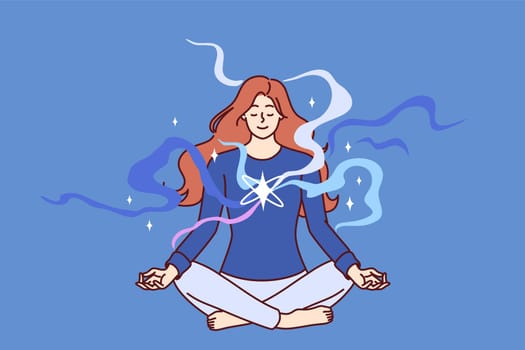 Concentrated woman meditating with closed eyes sitting cross-legged on floor and doing yoga lotus pose. Girl does yoga enjoying spiritual practices that open chakras and attract harmony