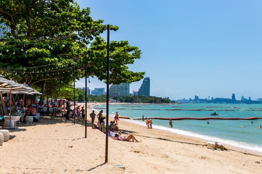 Pattaya, Thailand - 23 Mar 2023 After the Covid-19 pandemic, the number of foreign tourists visiting Pattaya beach has increased. Many people are swimming and sunbathing. Daytime.
