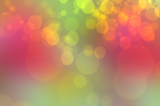 A festive abstract gradient green red orange yellow background texture with glitter defocused sparkle bokeh circles. Card concept for Happy New Year, party invitation, valentine or other holidays.