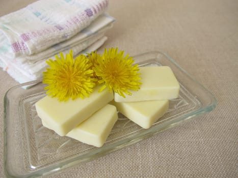 Homemade solid body butter with dandelion oil, cocoa butter, coconut oil