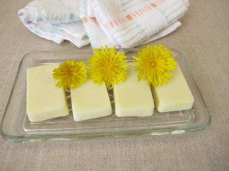 Homemade solid body butter with dandelion oil, cocoa butter, coconut oil