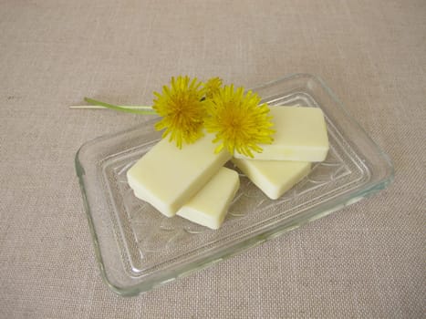Homemade solid body butter with dandelion oil, cocoa butter, coconut oil