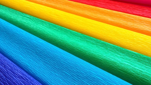 Pride Flag by Gilbert Baker. Symbol of the overall LGBTQ LGBTI community. Crepe paper is available in pink, red, orange, yellow, crepe, blue, purple and magenta. Colorful background for Pride events.