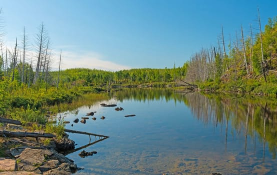 Morning Light on a Calm Lake on Jasper Lake in the Boundary Waters in Minnesota