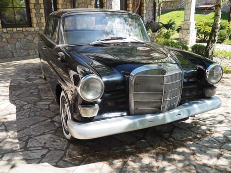 Stanisici, Bijelina, BiH, 25 April 2021. Retro or vintage style. Car Mercedes Benz Ponton in black with silver trimmings. Nice car. Retro car in good condition. Product of the German car industry.