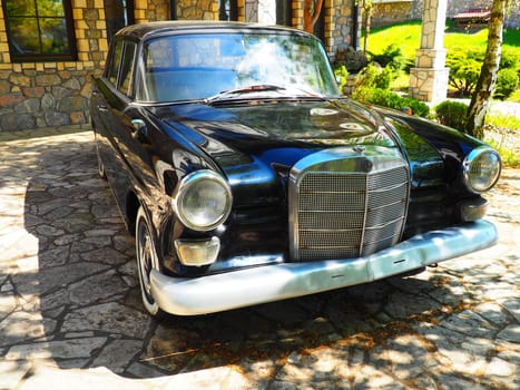 Stanisici, Bijelina, BiH, 25 April 2021. Retro or vintage style. Car Mercedes Benz Ponton in black with silver trimmings. Nice car. Retro car in good condition. Product of the German car industry.