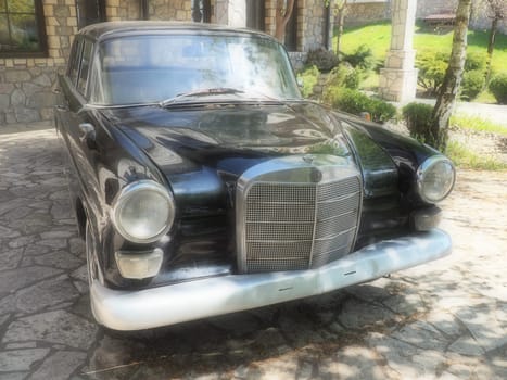 Stanisici, Bijelina, BiH, 25 April 2021. Retro or vintage style. Car Mercedes Benz Ponton in black with silver trimmings. Nice car. Retro car in good condition. Product of the German car industry.