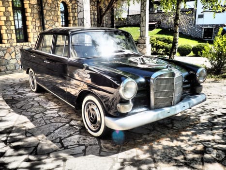 Stanisici, Bijelina, BiH, 25 April 2021. Retro or vintage style. Car Mercedes Benz Ponton in black with silver trimmings. Nice car. Retro car in good condition. Product of the German car industry.