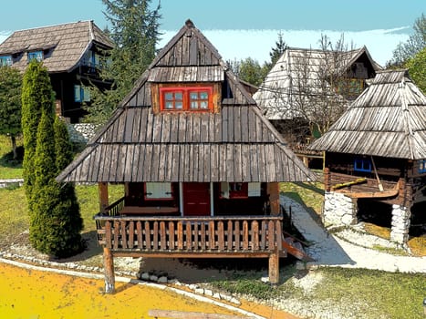 Stanisici, Bijelina, Bosnia and Herzegovina, 25 April 2021. Log village farmhouse. 19th century Bosnian mountain traditional dwelling. Restored ethno building, implements of agricultural labor