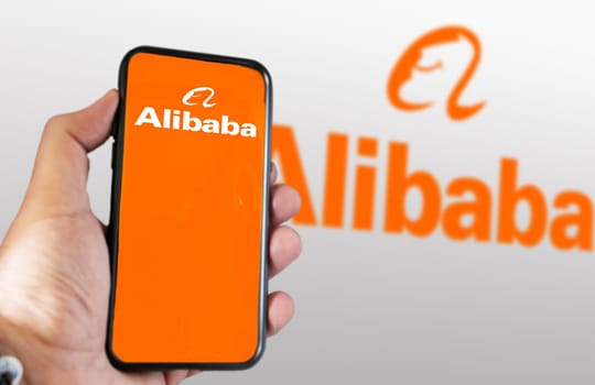 Beijing, CN, March 2023: hand holding a phone with Alibaba mobile app on the screen. On march 2023 Alibaba Gourp has decided to split its business into 6 separate units. Illustrative editorial