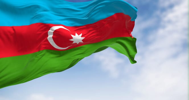 The national flag of Azerbaijan waving in the wind on a clear day. Horizontal tricolour of blue, red, green with a white crescent and star. 3D illustration render. Rippled textile