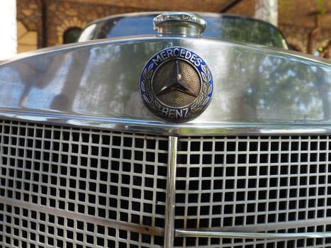 Stanisici, Bijelina, Bosnia and Herzegovina, April 25, 2021. Mercedes Benz pontoon, retro car. Cover of the engine compartment of the car. Part of the body with a metal grille from the engine