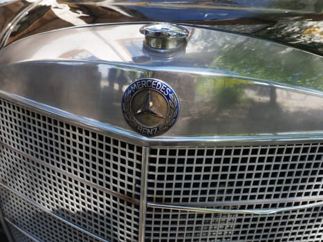 Stanisici, Bijelina, Bosnia and Herzegovina, April 25, 2021. Mercedes Benz pontoon, retro car. Cover of the engine compartment of the car. Part of the body with a metal grille from the engine