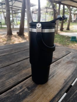 Reusable steel thermal water cup, stock photo