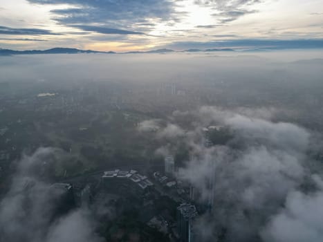 Aerial view Kuala Lumpur in natural morning fog overcast weather