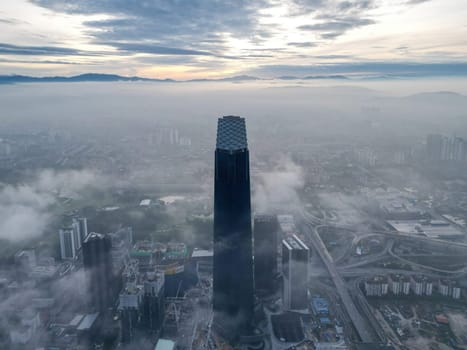 Drone view fog day at TRX Exchange 106 building in overcast morning