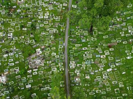 Aerial top down view of green lush Muslim cemetery