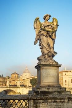 Beautiful angel with Cross in the Bridge of Saint Angelo Castle, Rome