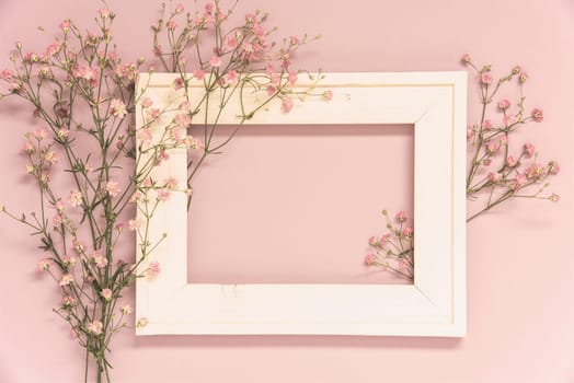 Vintage Photo Frame With Ikebana Flower Arrangement With Copy Space For Free Text. Retro Pastel Background