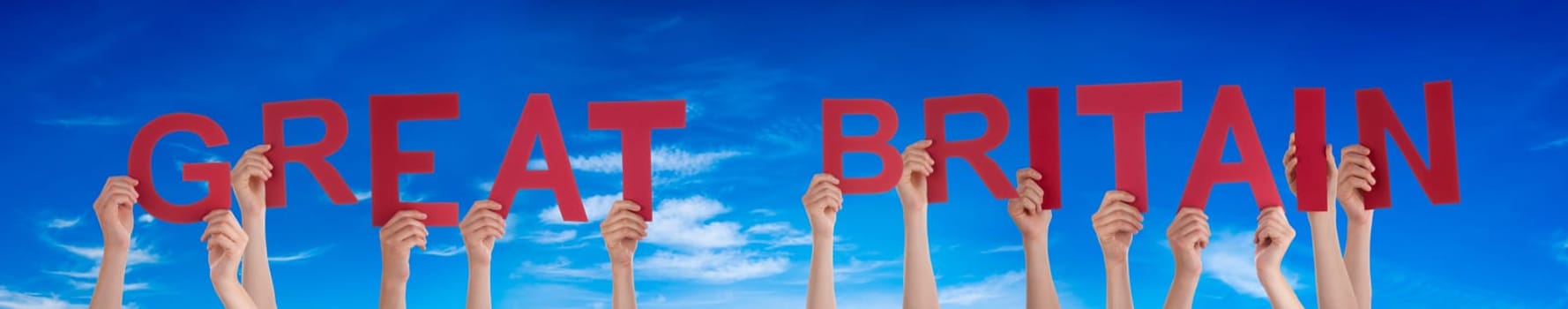 People Or Persons Hands Building English Word Great Britain. Blue Sky As Background.