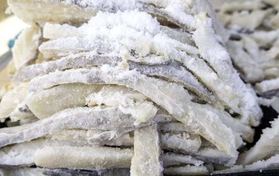 Detail of dried fish with salt in a market, healthy food
