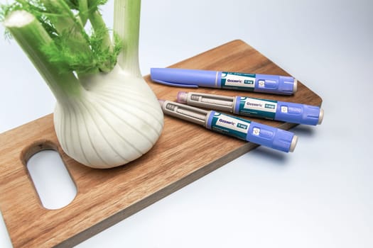 Insulin injection pen and fennel vegetable root for diabetics and weight loss. Copenhagen, Denmark - February 16, 2025