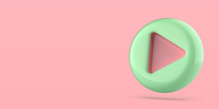 Green plastic play button on pink background