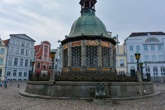 Water art fountain in the middle of the historic Hanseatic city of Wismar, on the Baltic Sea coast of Mecklenburg-West Pomerania in Germany