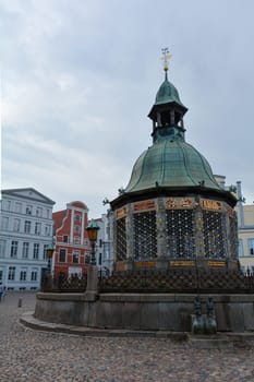Water art fountain in the middle of the historic Hanseatic city of Wismar, on the Baltic Sea coast of Mecklenburg-West Pomerania in Germany