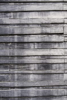 Detail of gray wooden wall in a facade, decoration