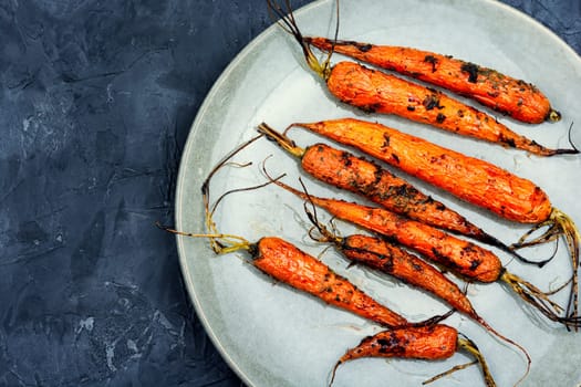 Baked carrots in a ceramic form. Top view
