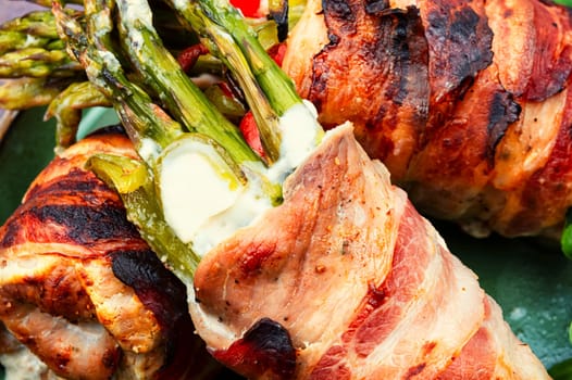 Fried meatloaf wrapped in bacon. Meat roulades stuffed with asparagus. Ketogenic diet.