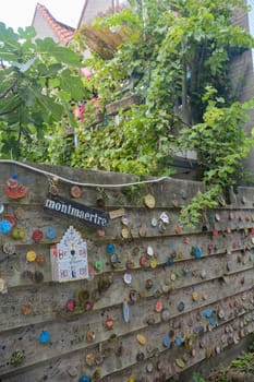 Zierikzee, The Netherlands August 27th 2020 - Plein Montmaertre - Wooden discs with wishes hang on a wooden fence