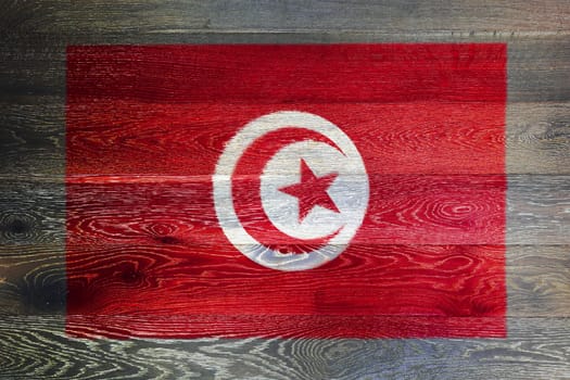A Tunisia flag on rustic old wood surface background