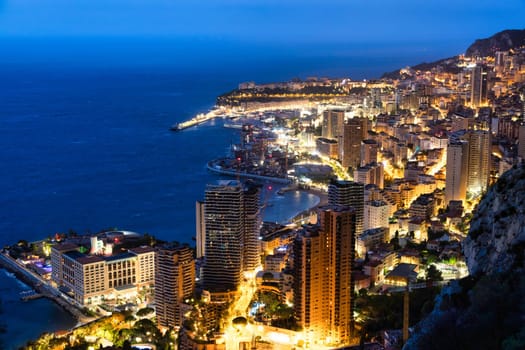 Monte Carlo panorama illuminated by night. Urban landscape with luxury architecture