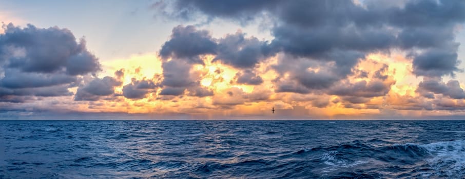 dreamlike sunset panorama on the open wide sea