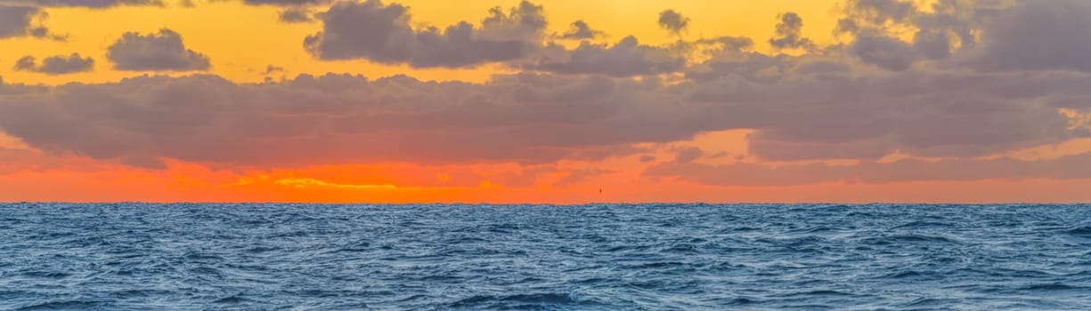 dreamlike sunset panorama on the open wide sea