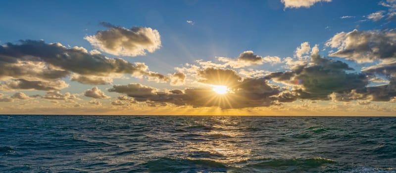 dreamlike sunset panorama on the open wide sea