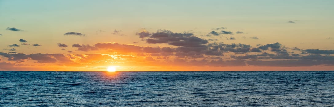 dreamlike sunset panorama on the open wide sea