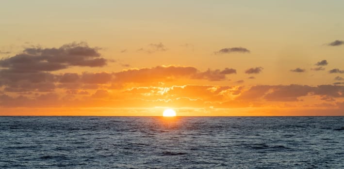 dreamlike sunset panorama on the open wide sea