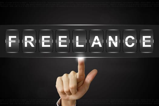 business hand pushing freelance on Flipboard Display