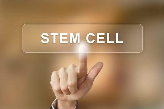 business hand pushing stem cell button on blurred background