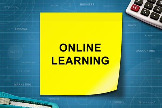 online learning text on yellow note with graph paper