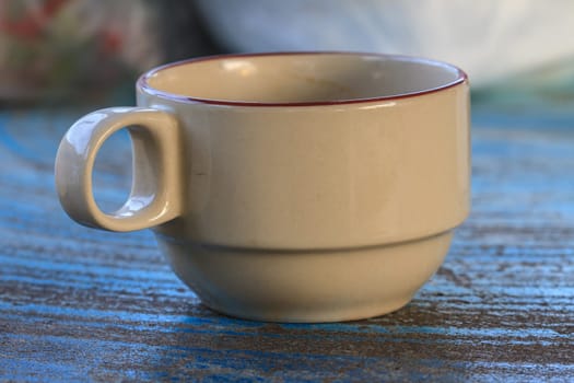 Cup of cappuccino coffee on wooden table