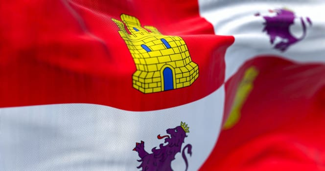 Close-up of Castile and Leon flag waving in the wind on a clear day. Castile and Leon is an autonomous community in north-western Spain. 3d illustration render. Selective focus. Rippled textile