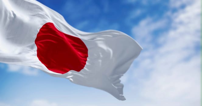 Japan national flag waving in the wind on a clear day. Red disc on a white field. Japan is an island country in East Asia. 3D illustration render. Rippled textile. Selective focus